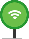 Green magnifying glass showing a Wi-Fi symbol